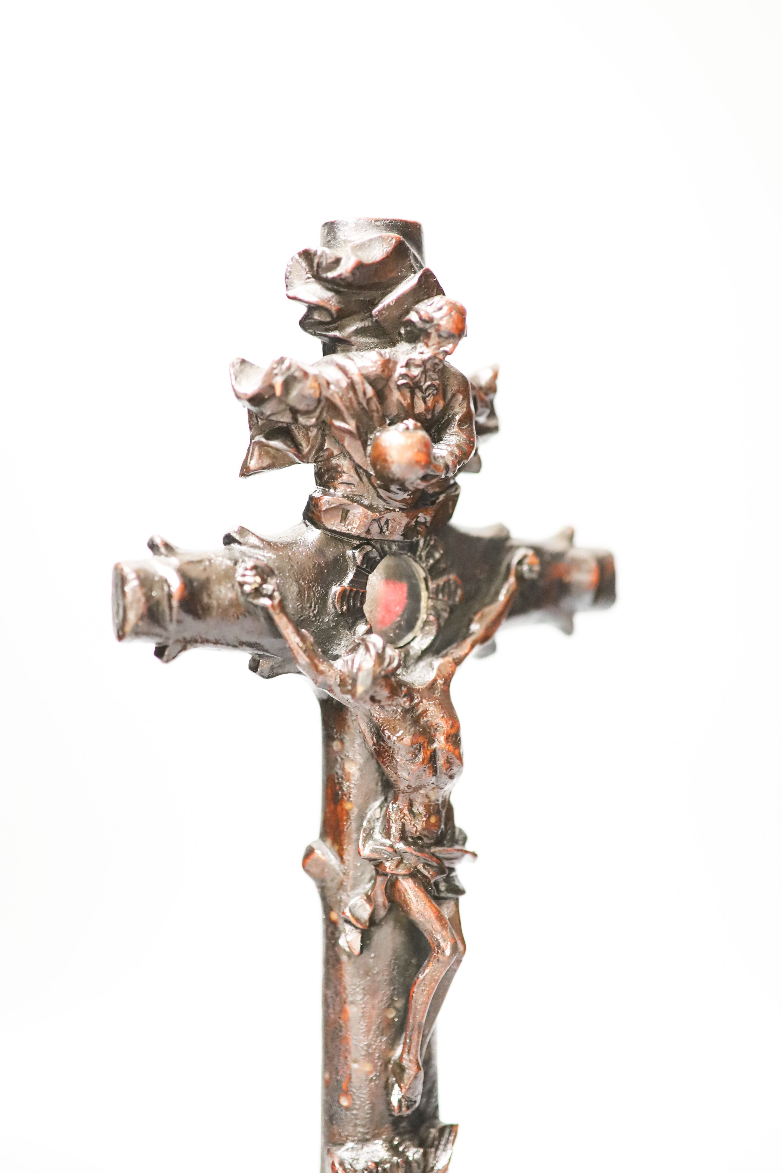 A carved wood crucifix 33cm